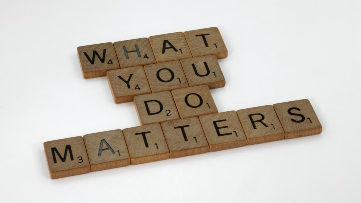Wooden letter tiles spelling 'What You Do Matters' on a neutral background.